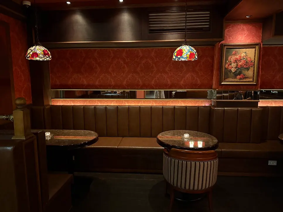 Bar seats where cocktails can be watched being made