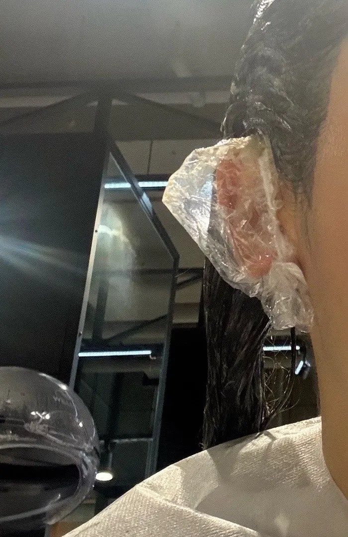 Neck and ears covered in preparation for dye application