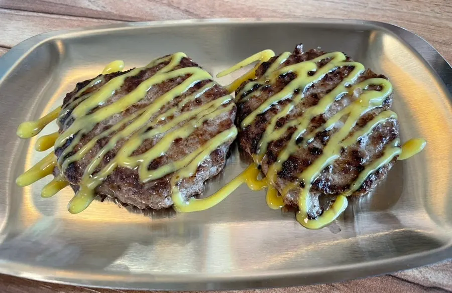 A spoonful of gomtang, rice and meat together