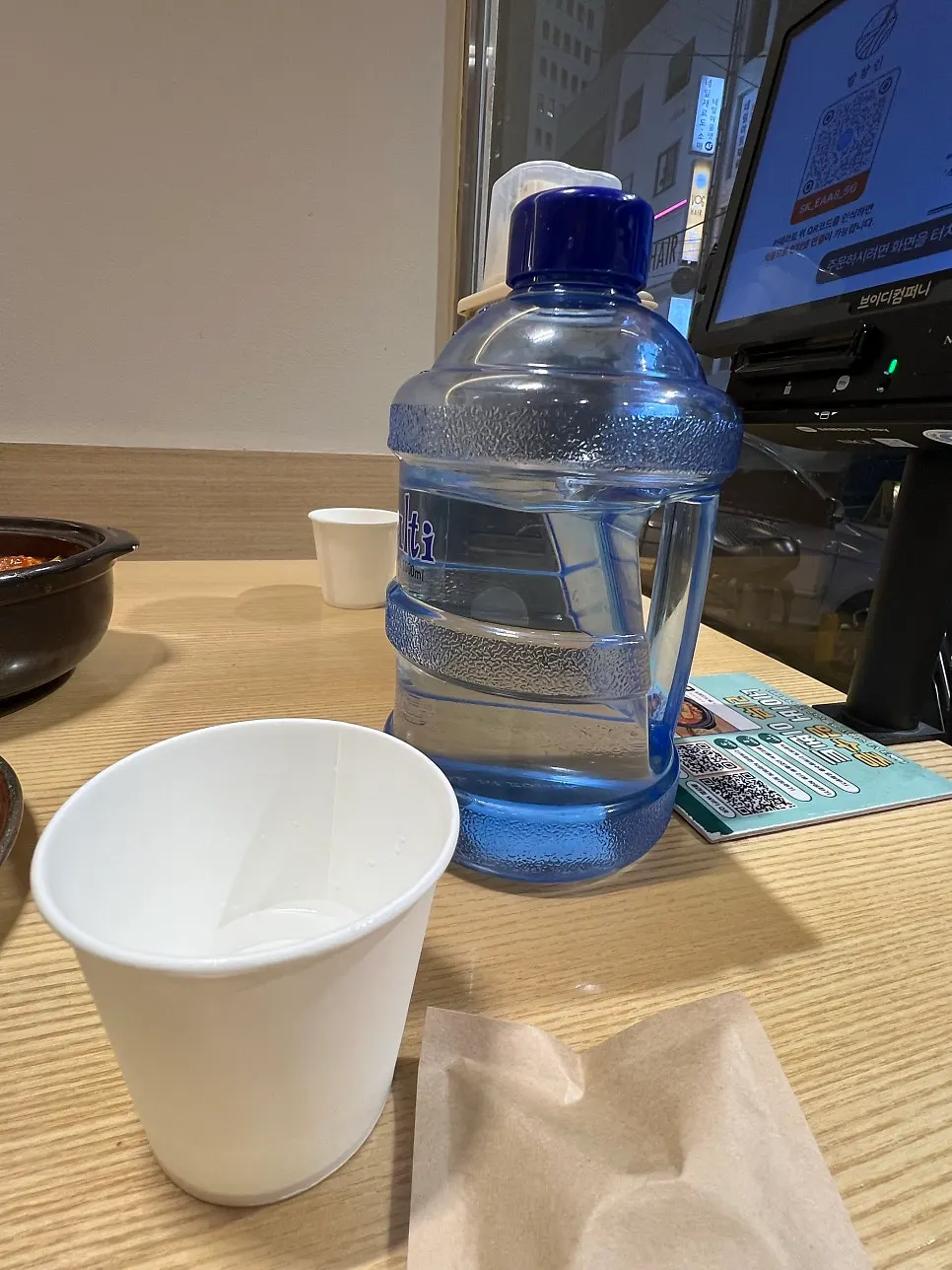 Self-serve bar corner with pickles and sesame oil