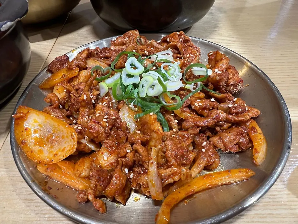 Spicy bulgogi topped with sesame seeds and scallions