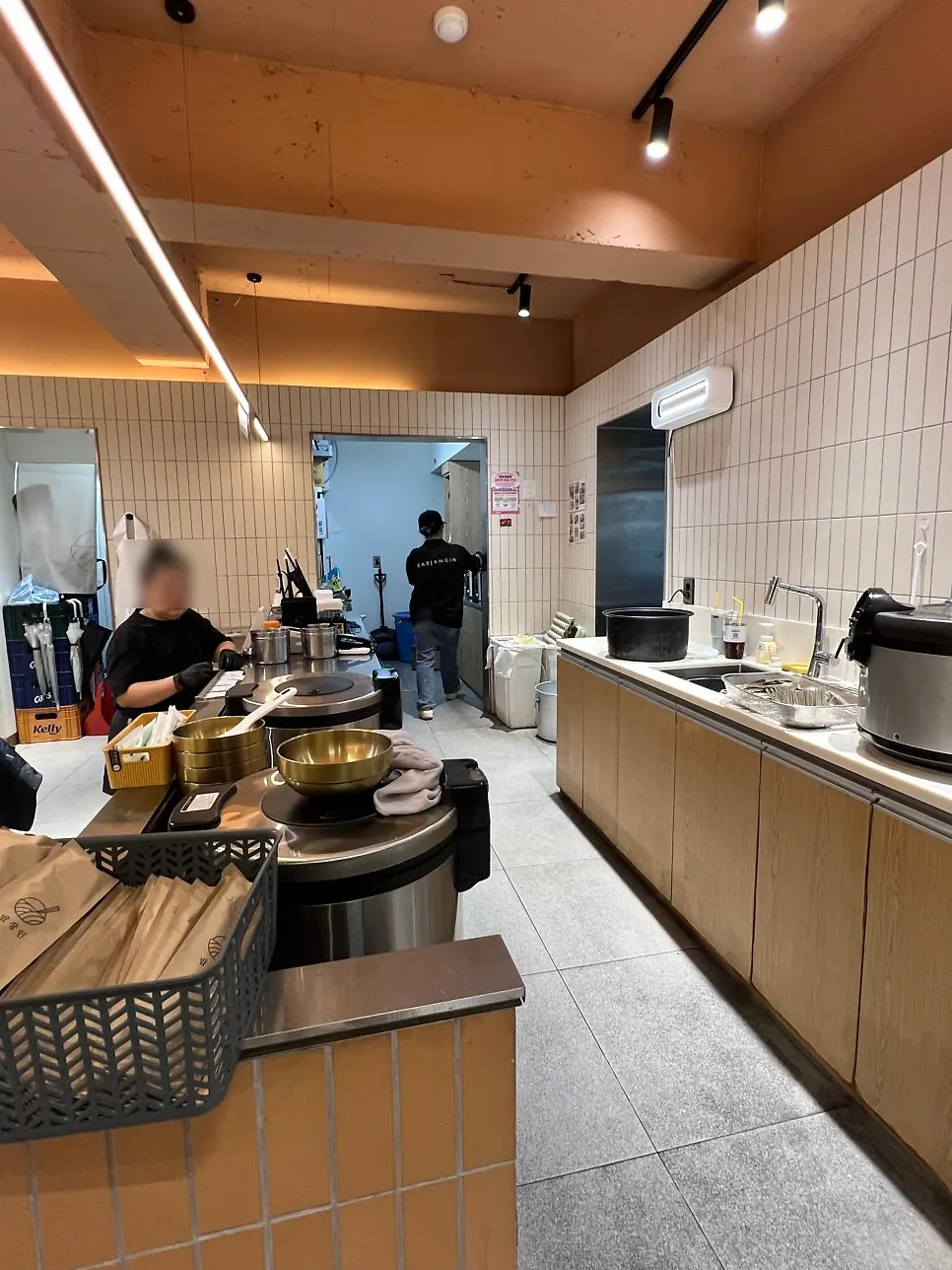 Open kitchen with stacked brassware