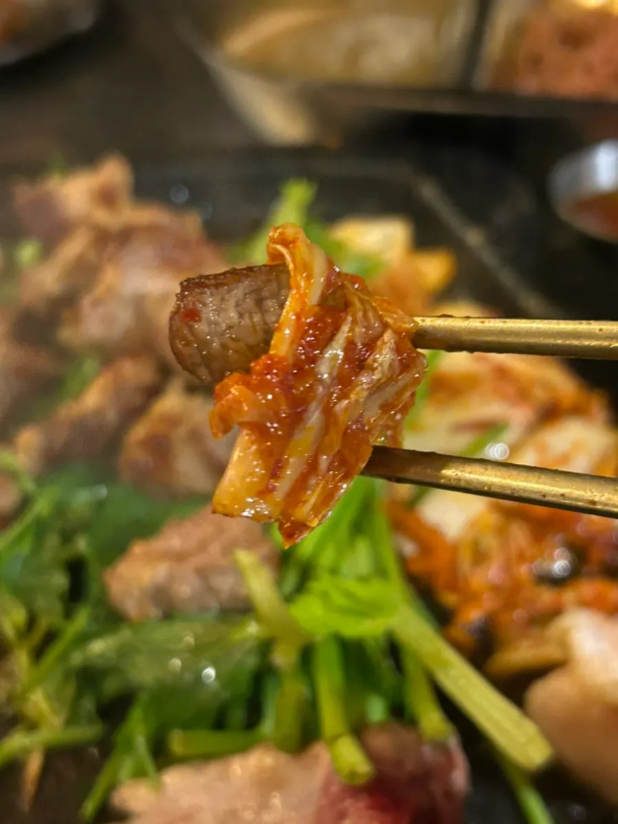 Forest-path view and grilled meat table setting