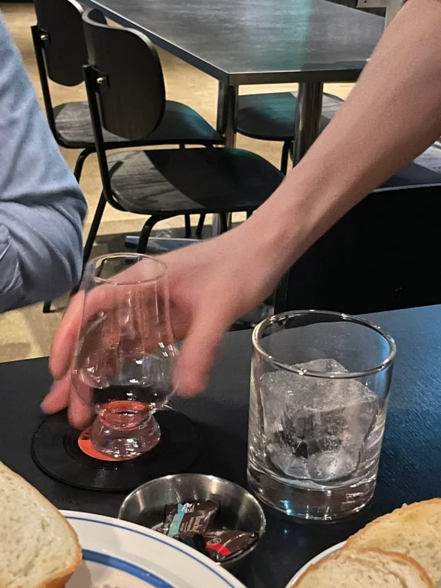 Glass of the prettily colored non-alcoholic cocktail Fox's Grapes