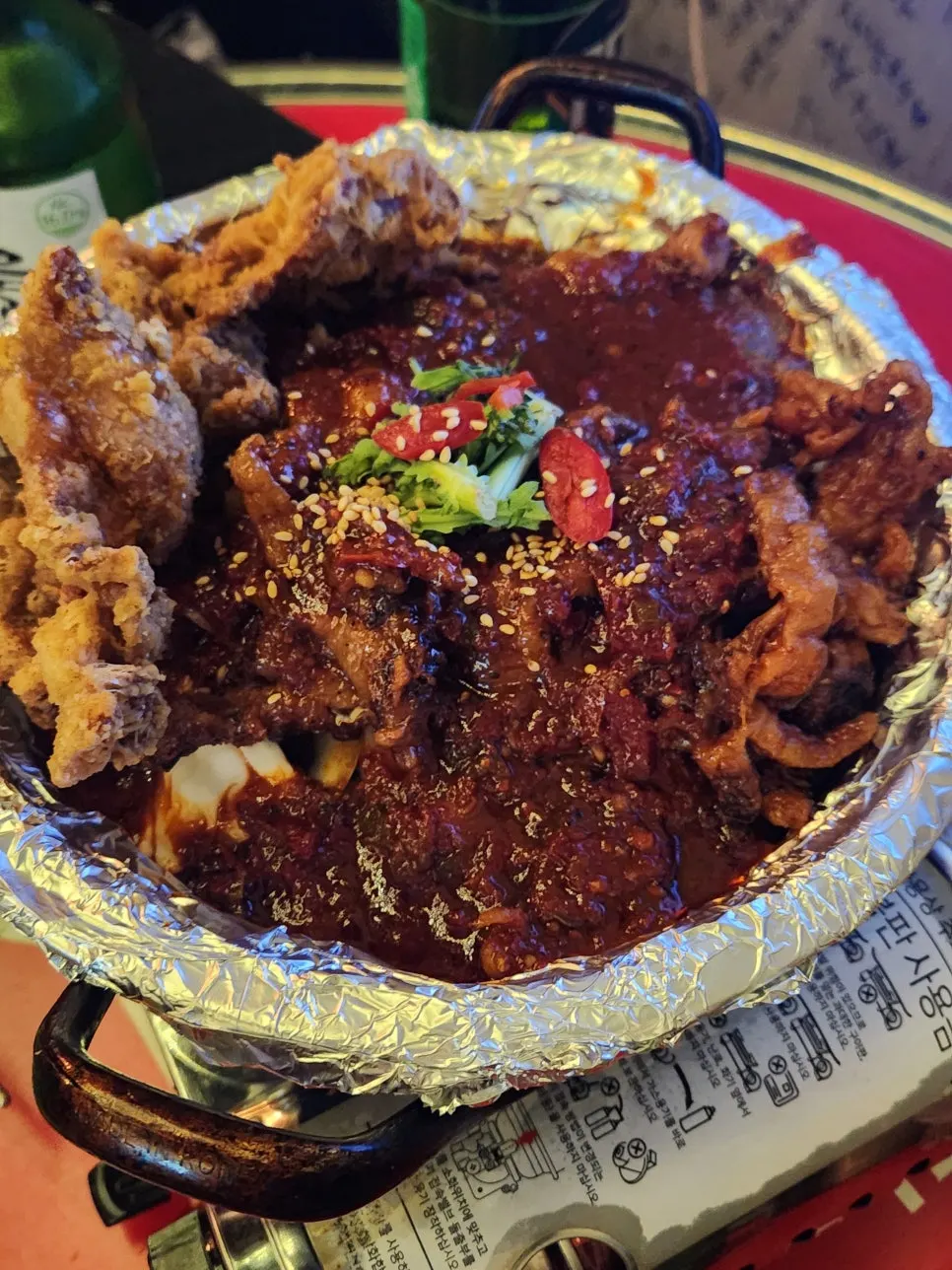 Close-up of soup chicken feet topped with fried chicken skin
