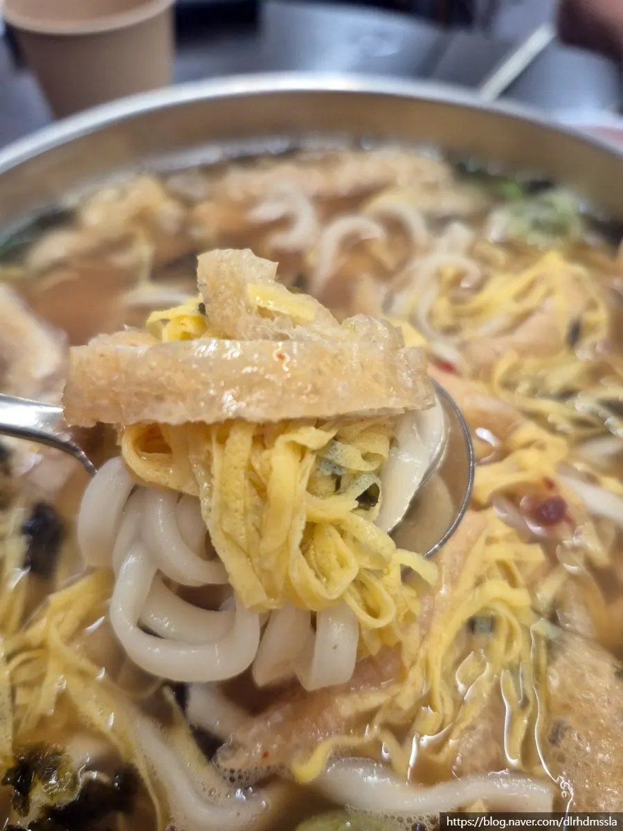 Rich anchovy broth in the kalguksu bowl
