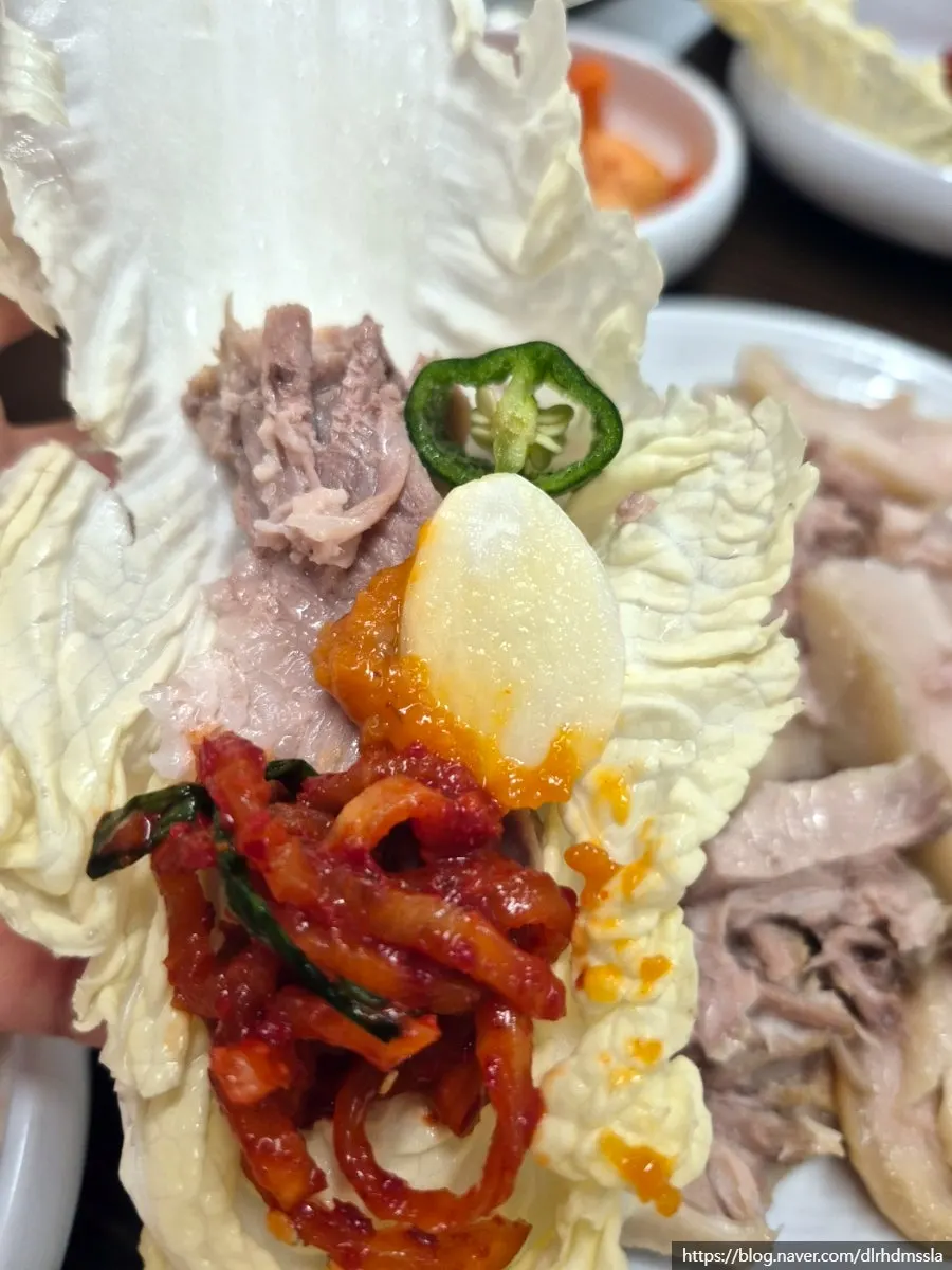 Bossam suyuk eaten together with napa cabbage kimchi