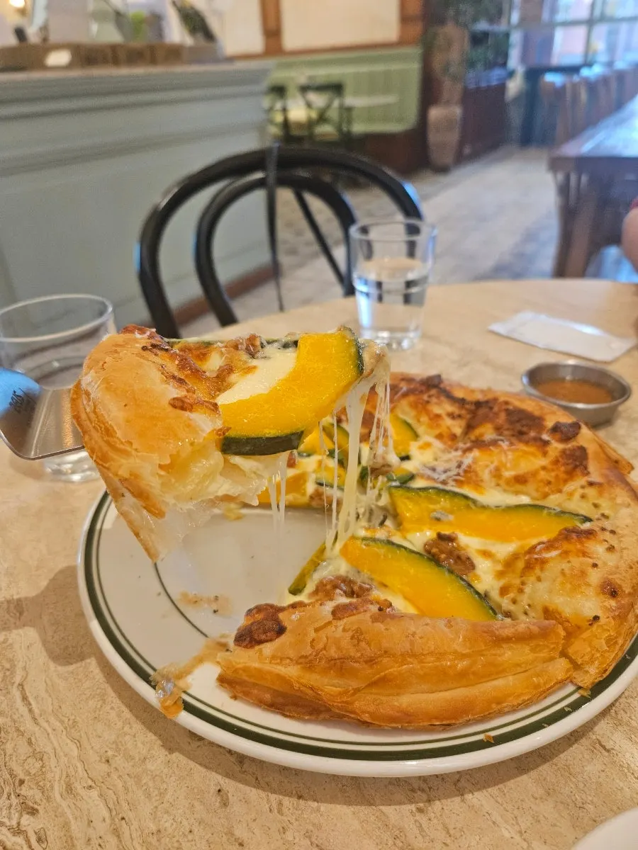 A whole sweet pumpkin gorgonzola pastry pizza