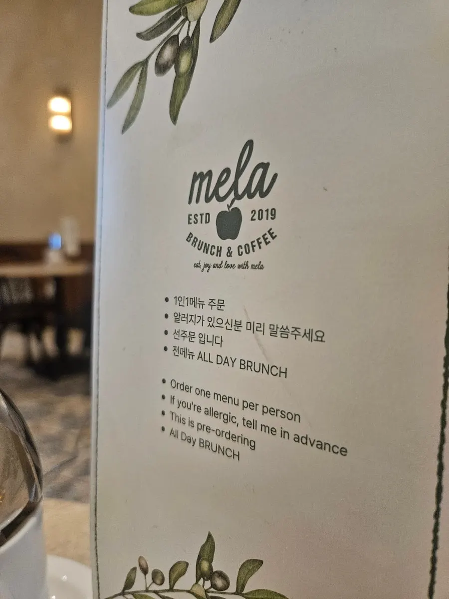 The menu placed on the table at MELA Hongdae