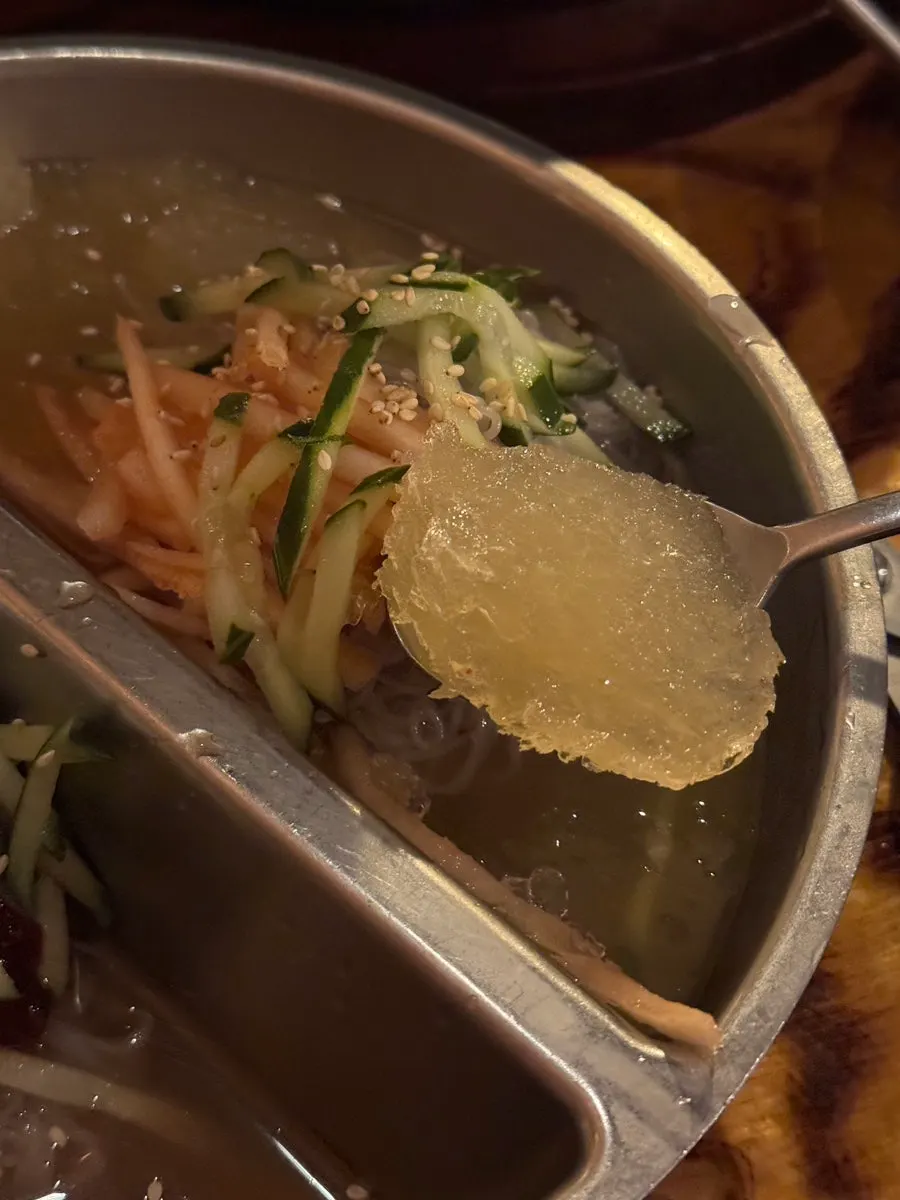 Half-and-half naengmyeon with both cold noodle soup and mixed noodles
