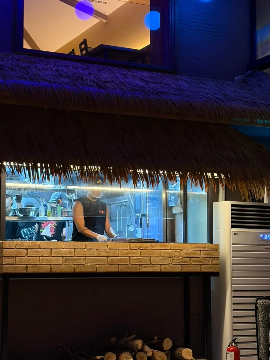 Hongdae outdoor-bar atmosphere with a giant screen
