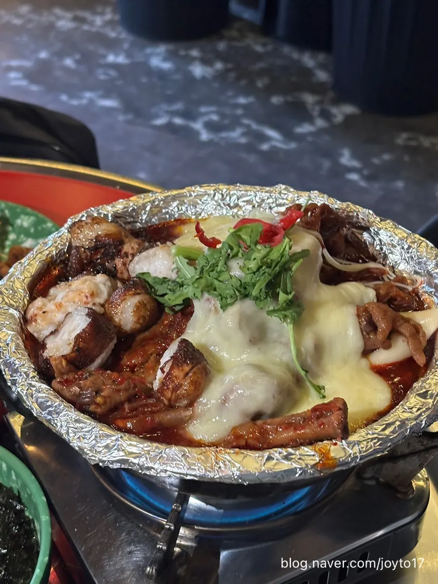 Tulip soup chicken feet topped with daechang and cheese
