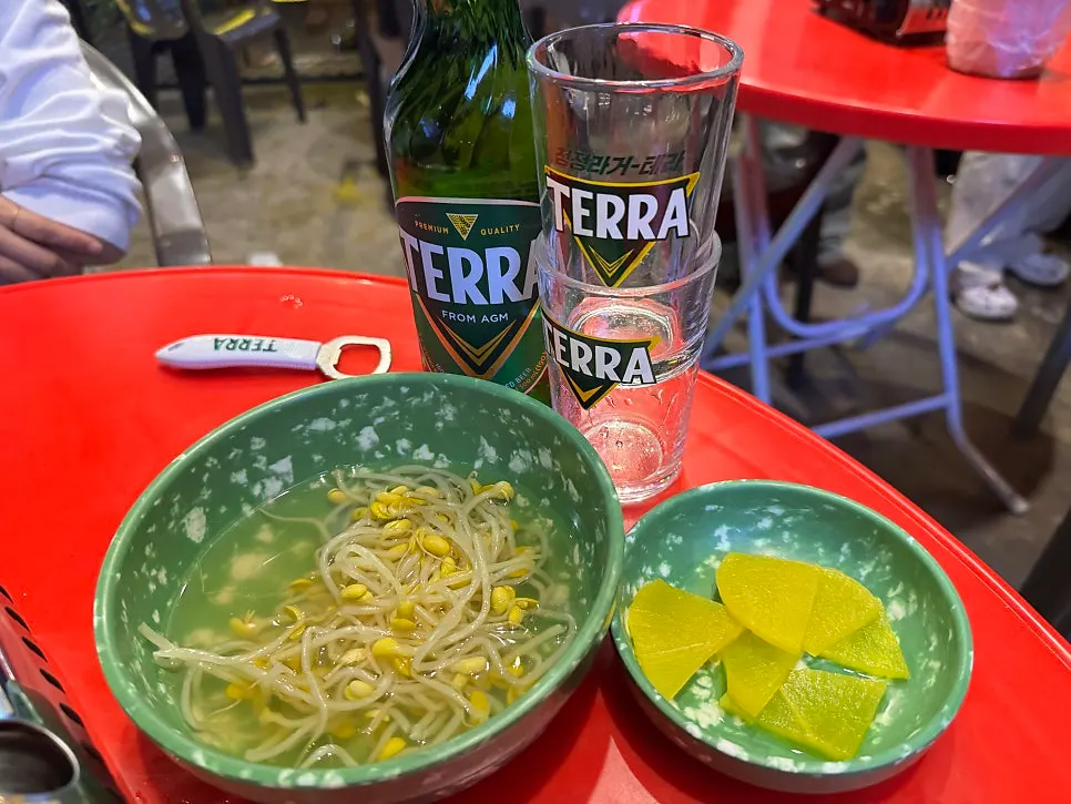 Complimentary cold bean sprout soup and pickled radish
