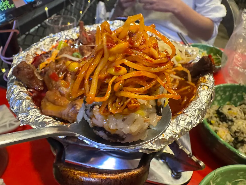 A bite of bean sprouts and chicken feet soaked in sauce