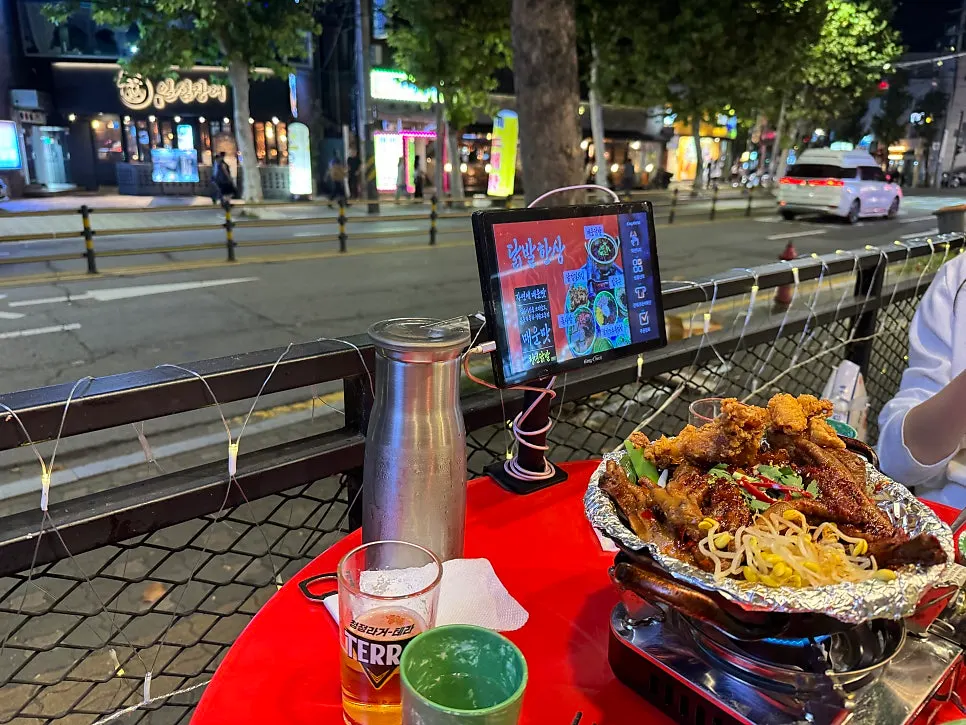 Closing spread of chicken feet and beer enjoyed on the outdoor terrace