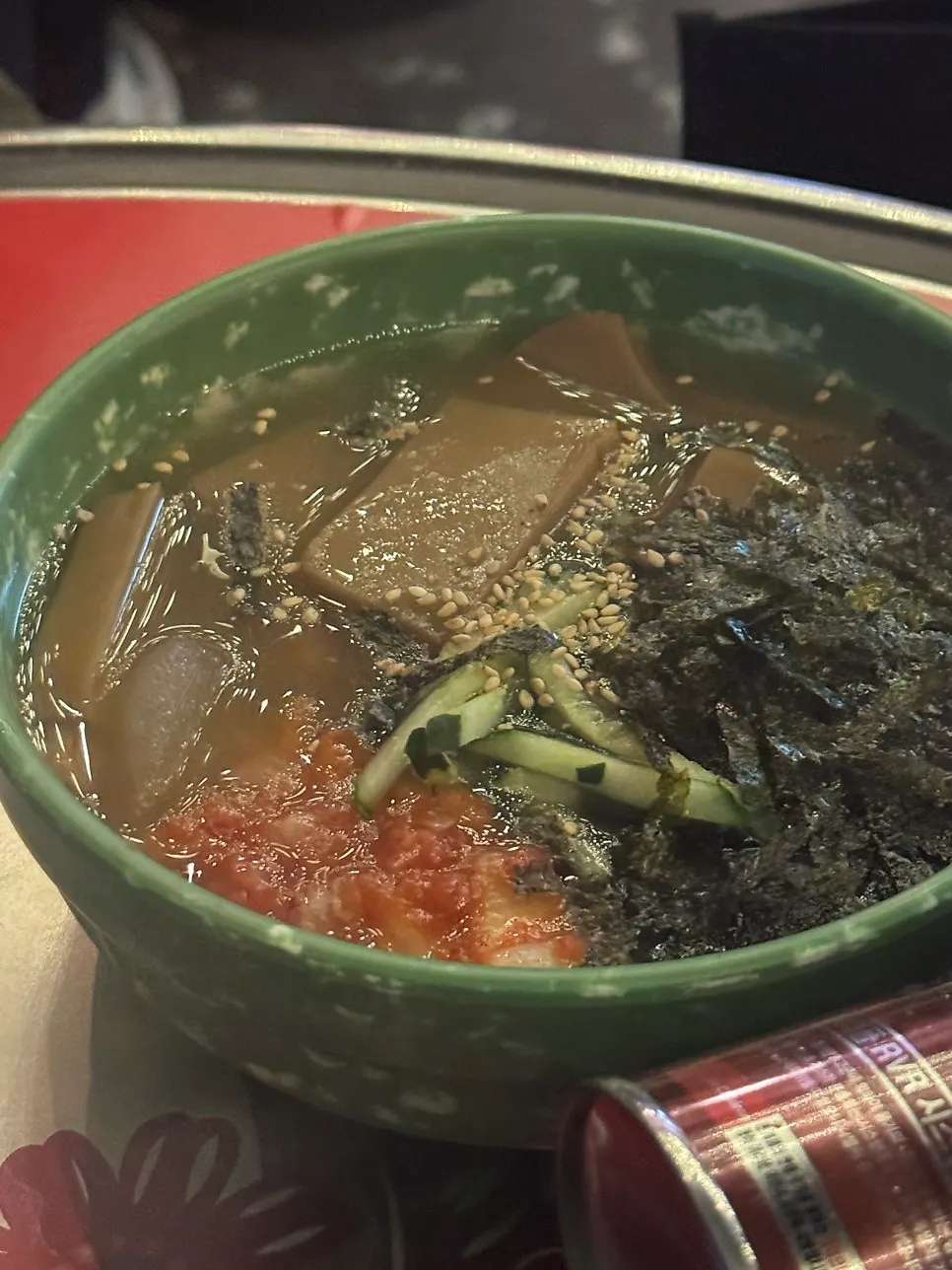 A bowl of kalguksu with soft noodles and broth