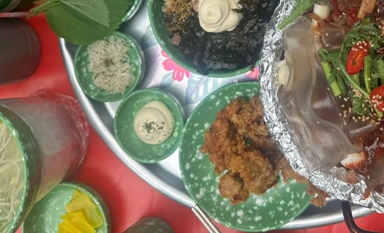 Perilla leaf topped with cellophane noodles and chicken feet