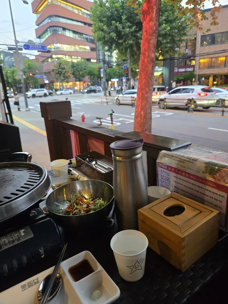 Window seating at Chopilsal Pork Grill Hongdae Branch with an outdoor dining feel