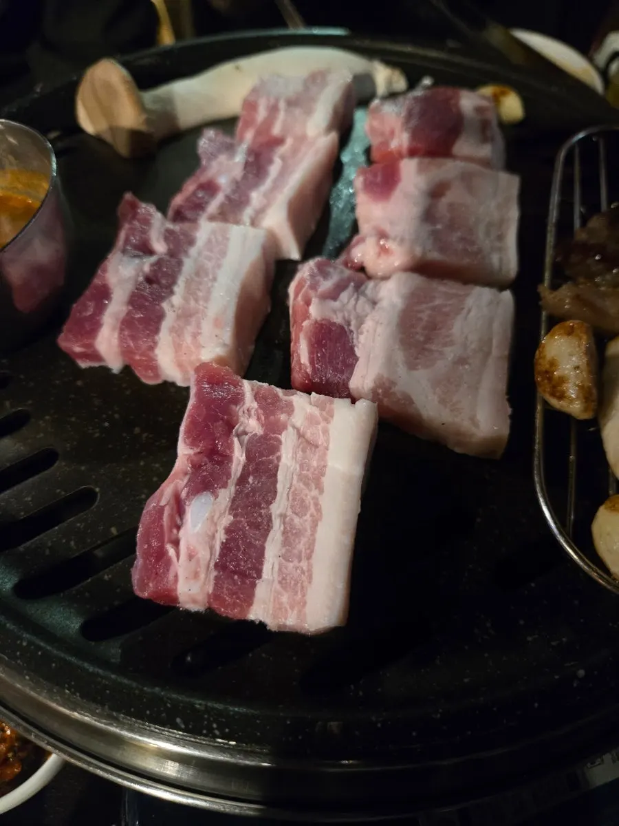 Fully cooked salted pork belly on the grill