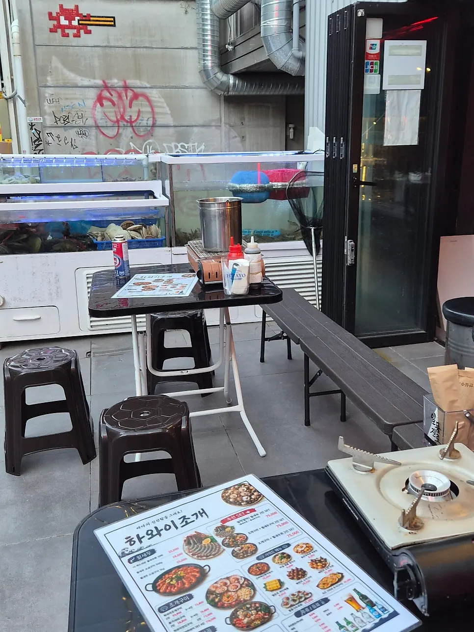 The restaurant entrance seen from beside the tank