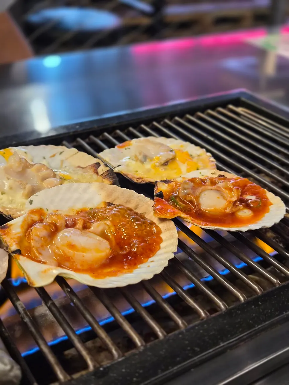 Cheese scallops cooking on the grill