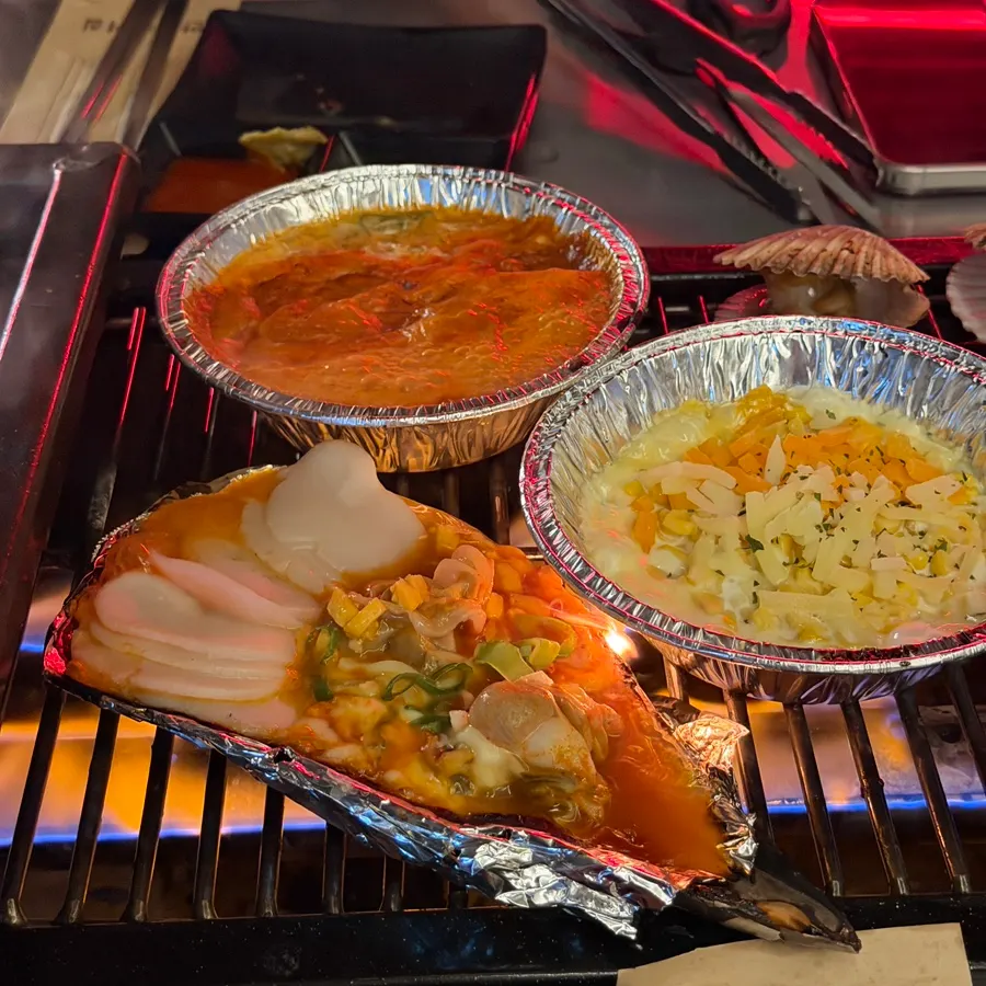 Cheese scallops cooking on the grill
