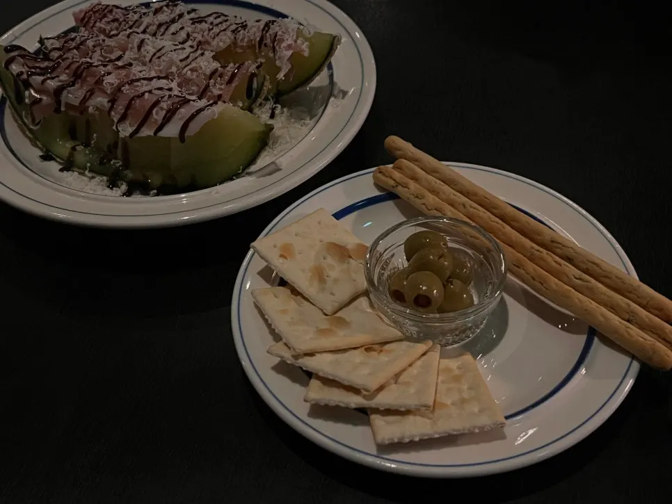 Table setting with the basic platter and melon jamón plate at Bitters