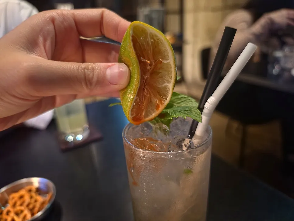 Close-up of the mojito glass topped with fruit
