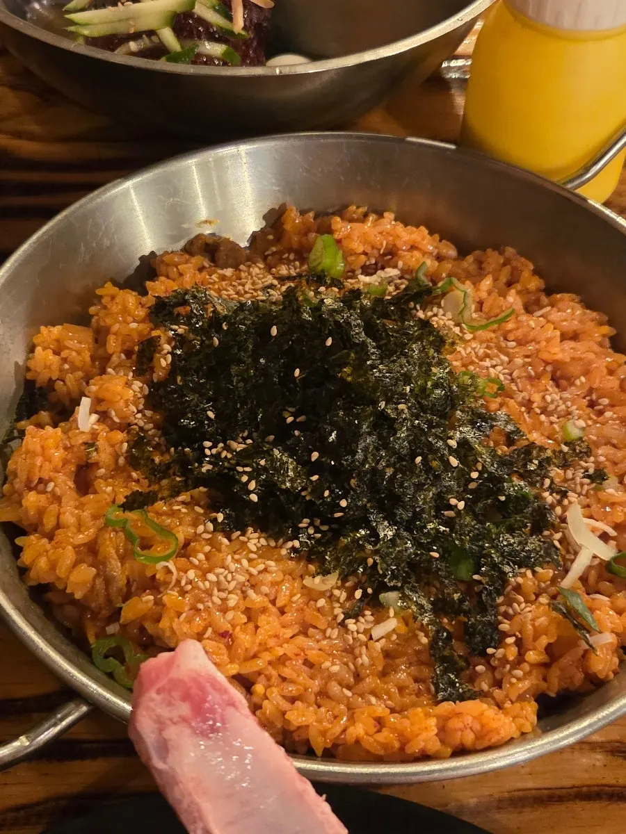 Half-and-half naengmyeon and kkakttuk bap side dishes