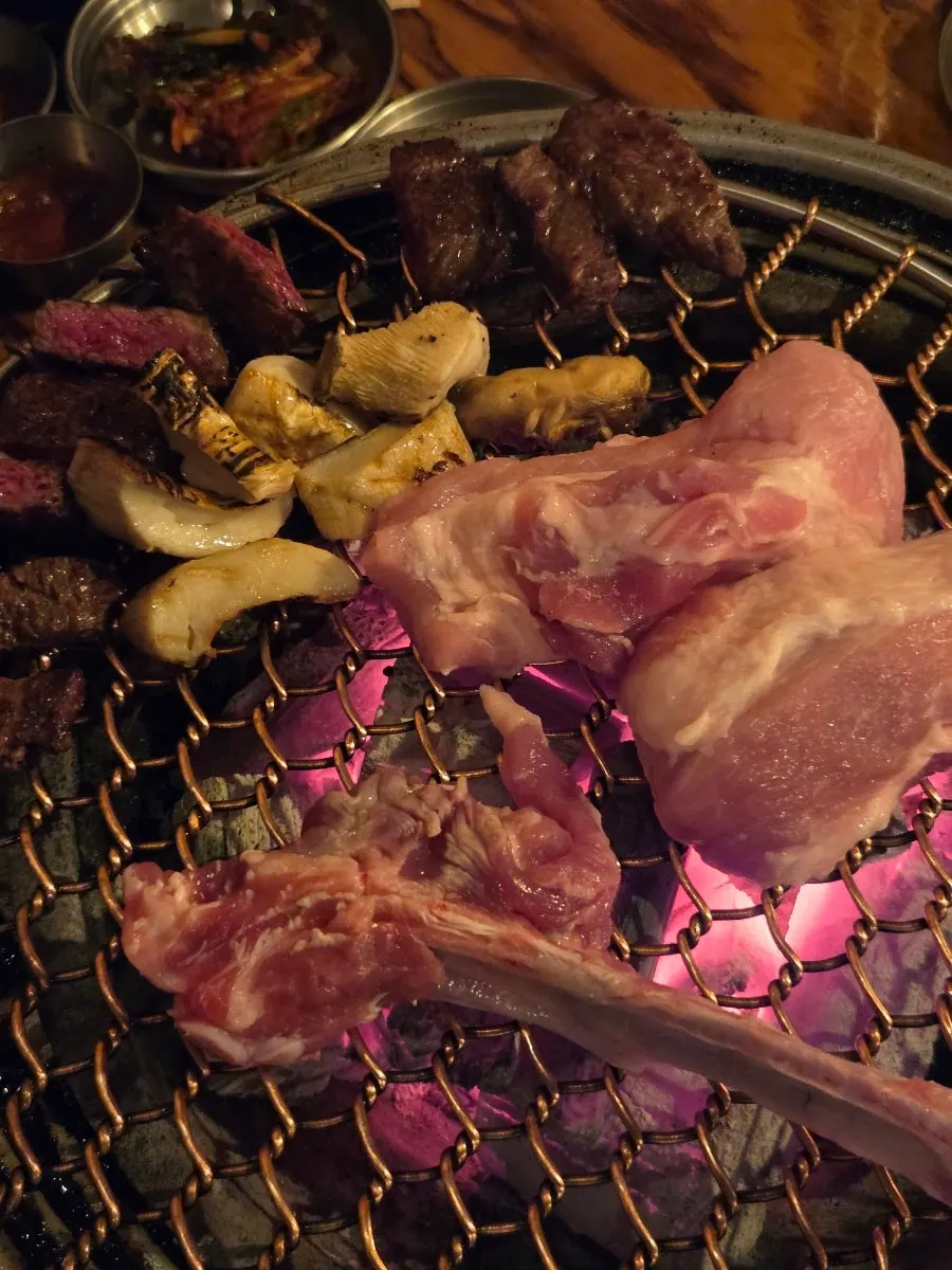 Korean beef, Korean pork, and basic side dishes on the table