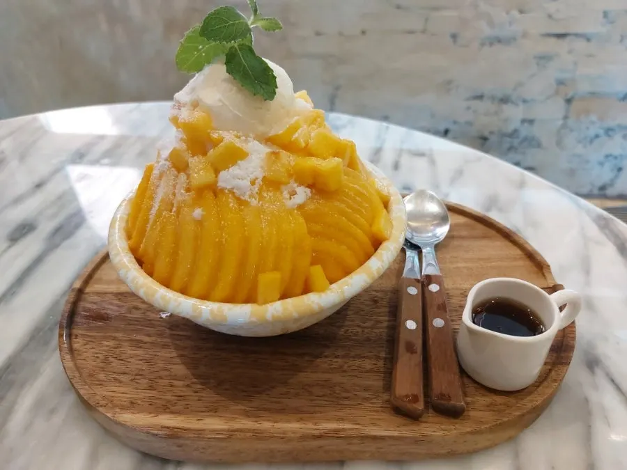 Close-up of MELA Hongdae's peach bingsu