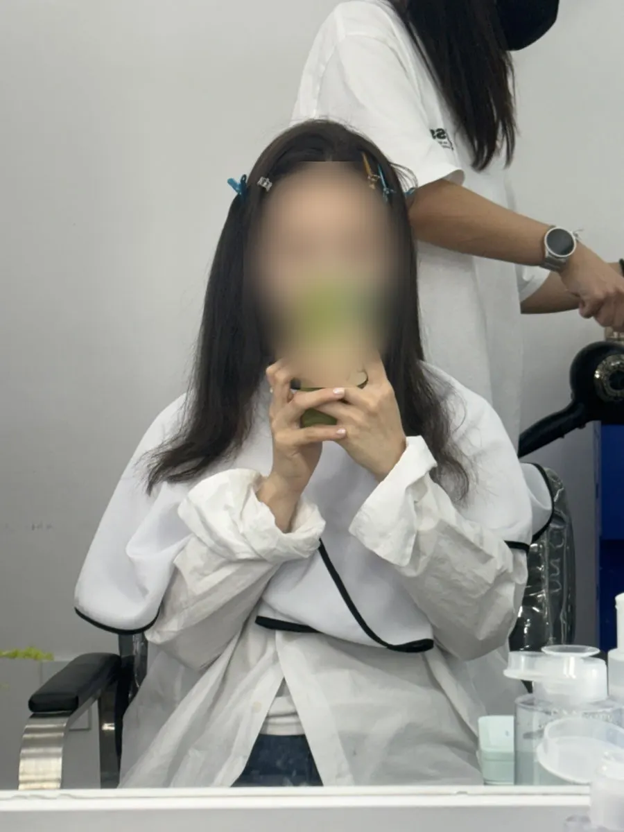 Hair pinned up before makeup begins
