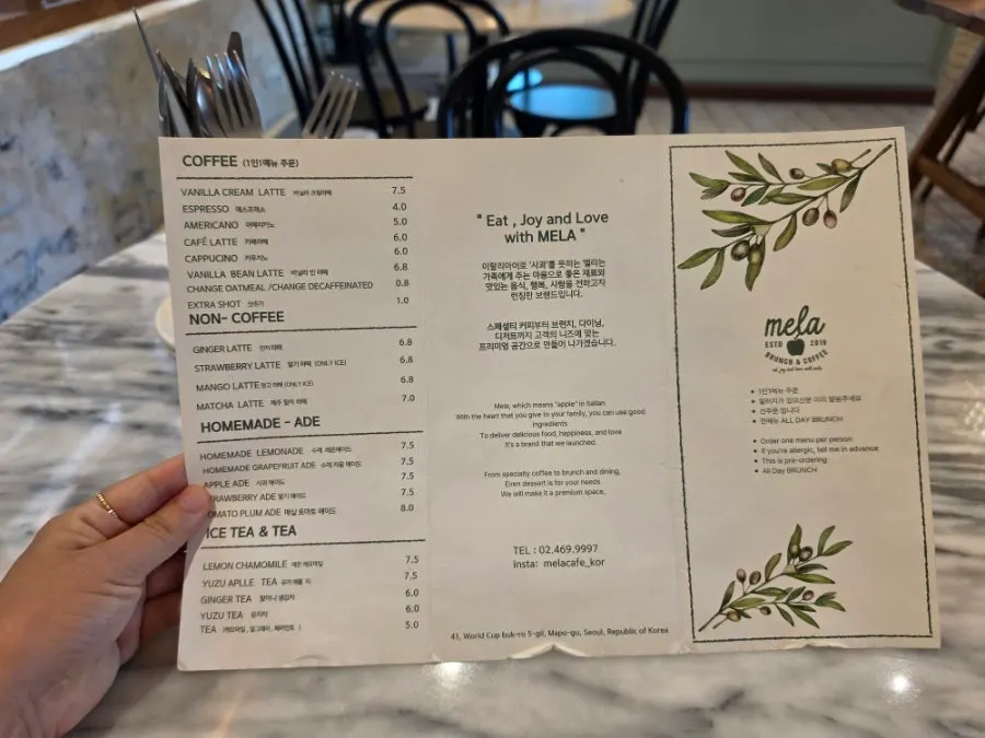 Brunch café interior with white and green accents
