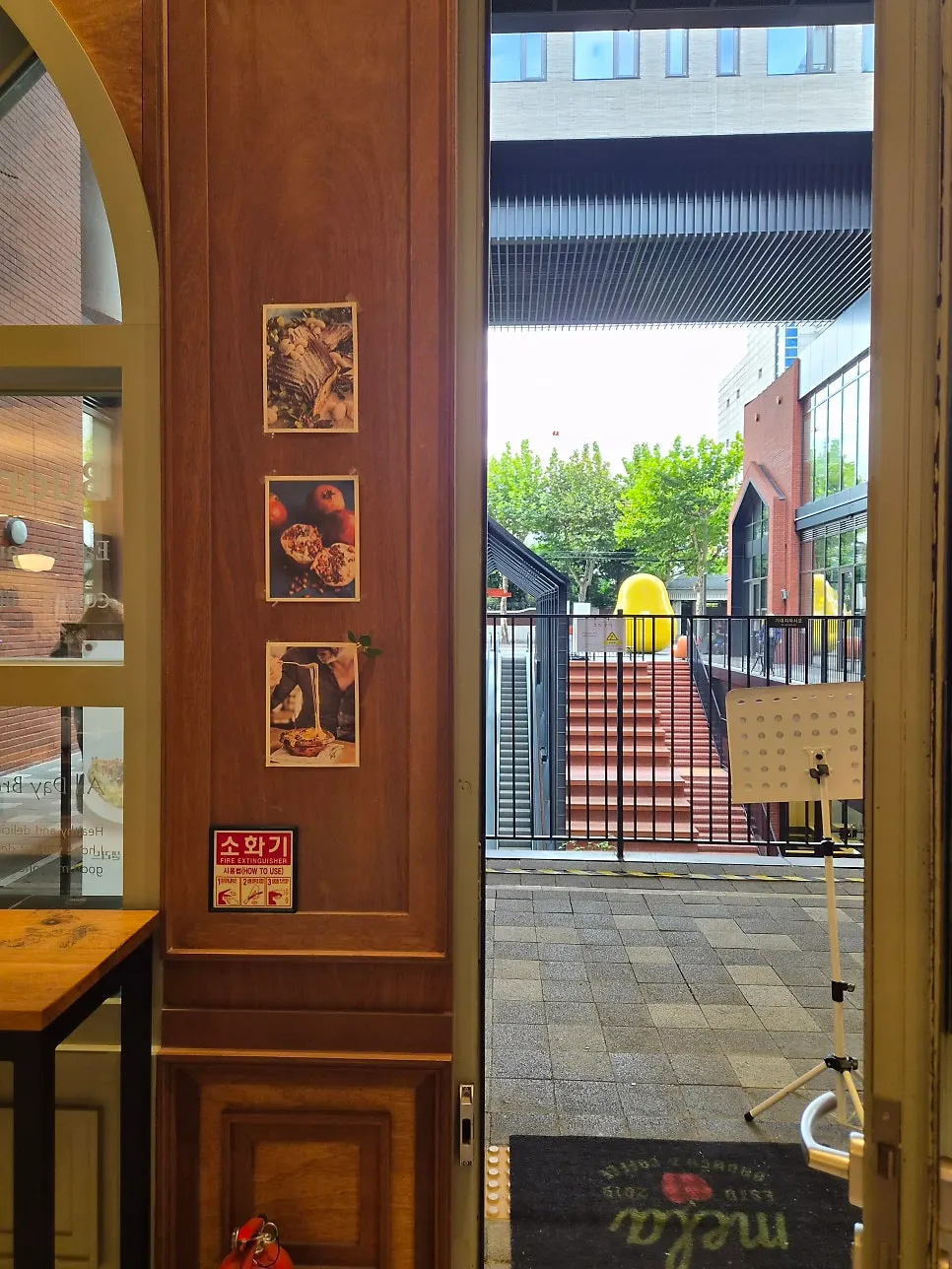 MELA Hongdae dining room with large windows and warm lighting