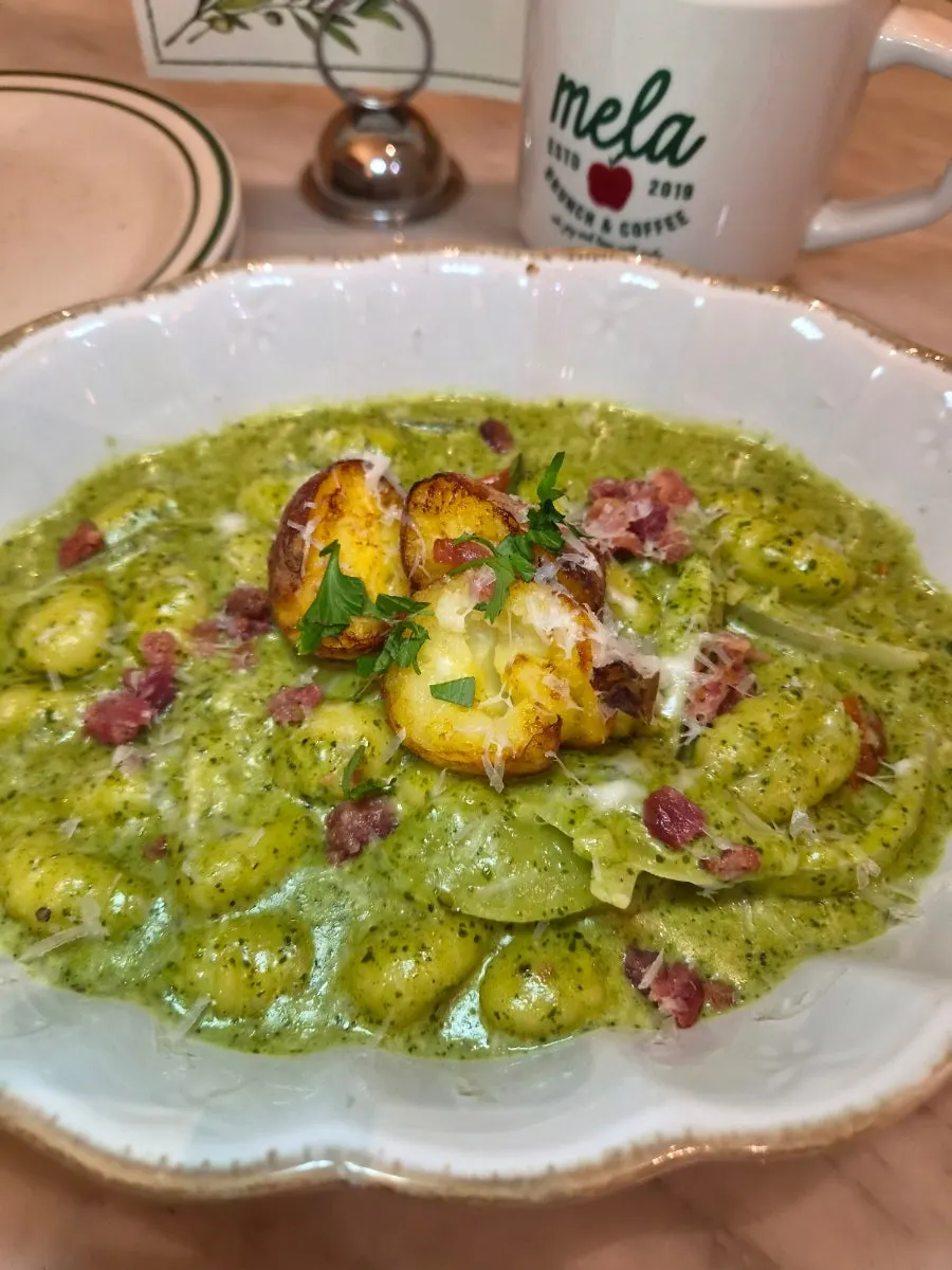 A plate of baby potato basil cream gnocchi