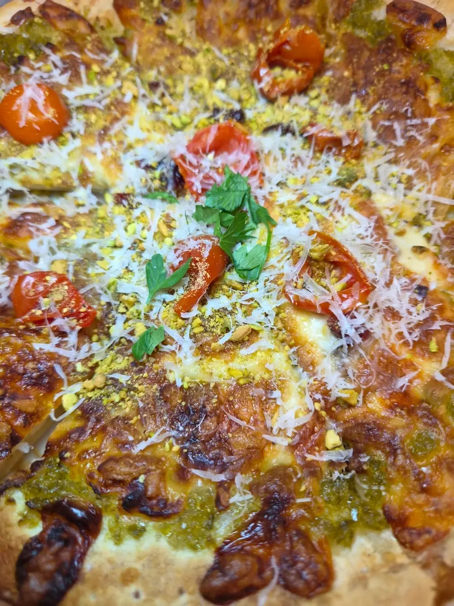 A slice of pizza topped with jalapeño