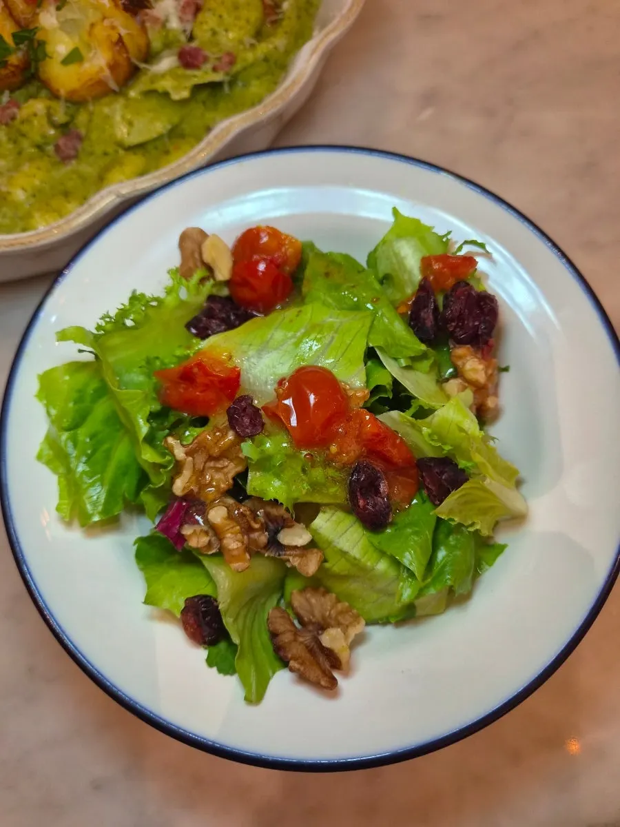 Mini salad with fresh vegetables and dressing