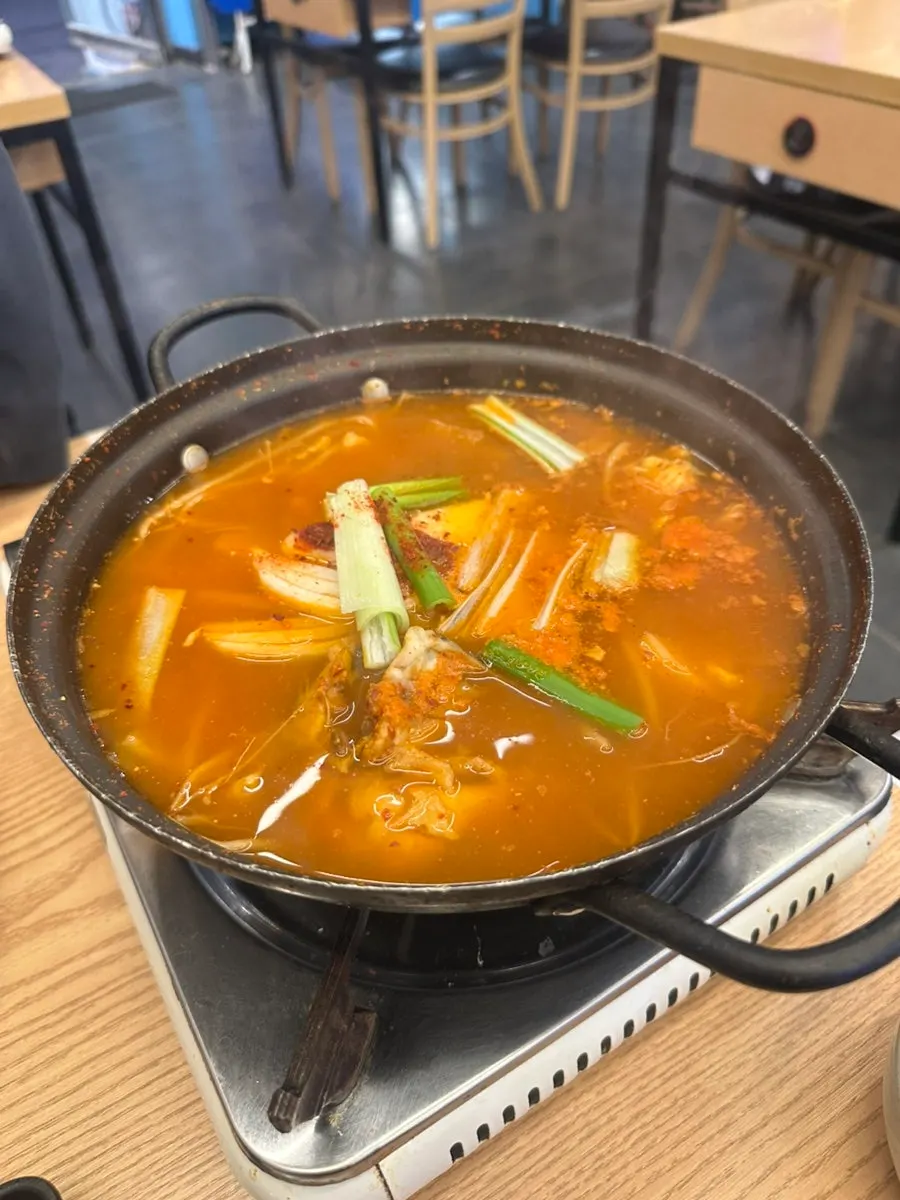 Pot of spicy fish stew included in the set