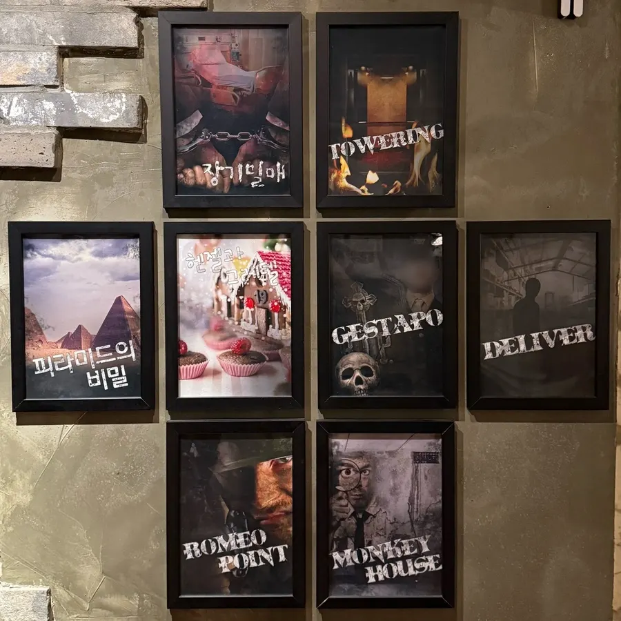 Escape room theme posters on the waiting area wall