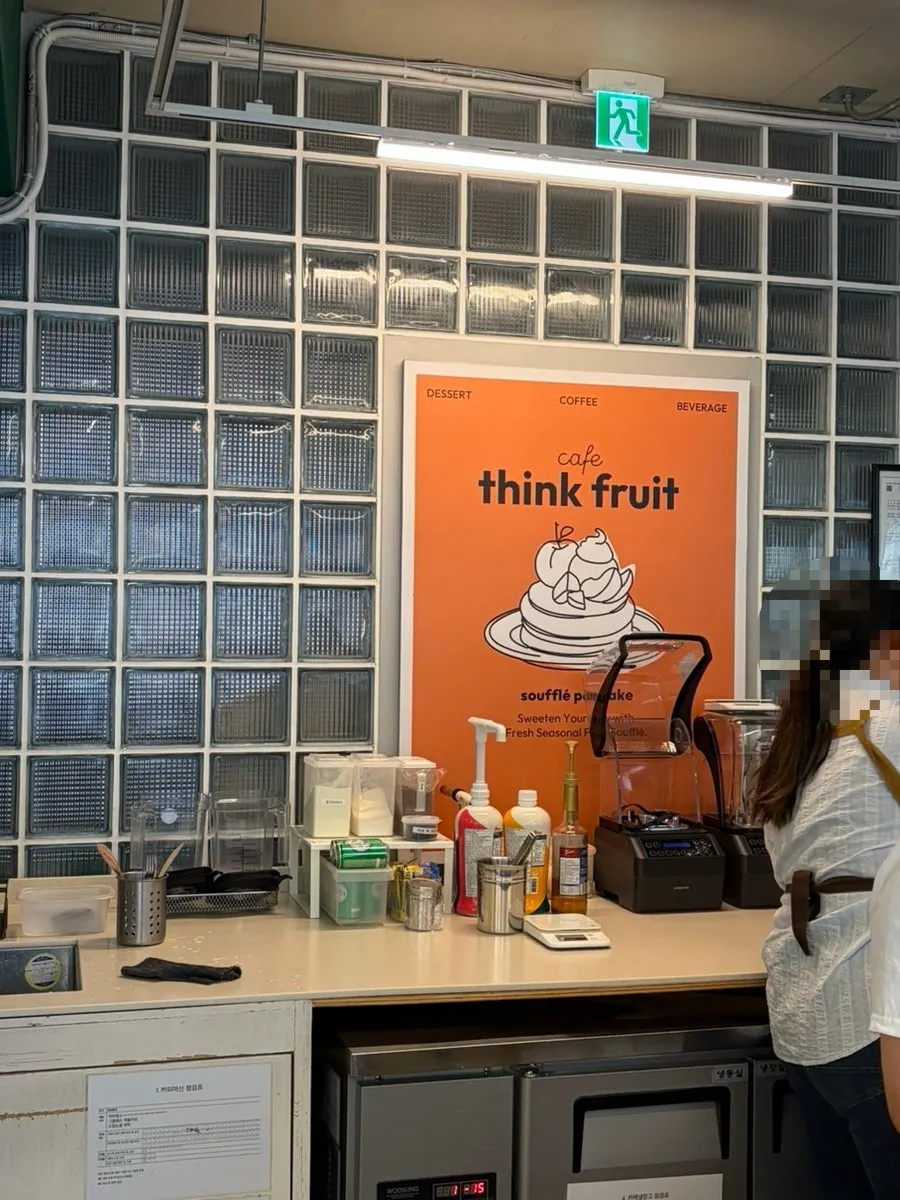 Interior of Think Fruit decorated in white tones