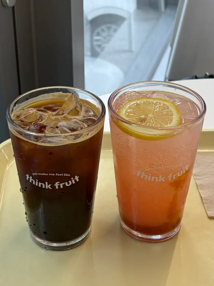 Iced Americano and peach lemonade served first