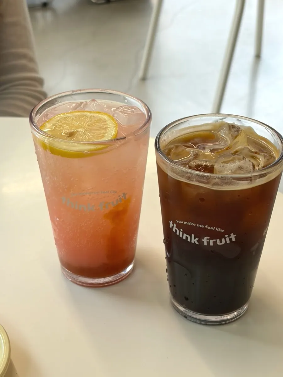 A glass of Think Fruit's peach lemonade