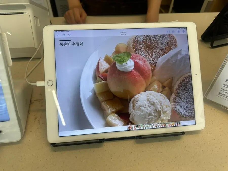Dessert menu photos displayed beside the ordering counter