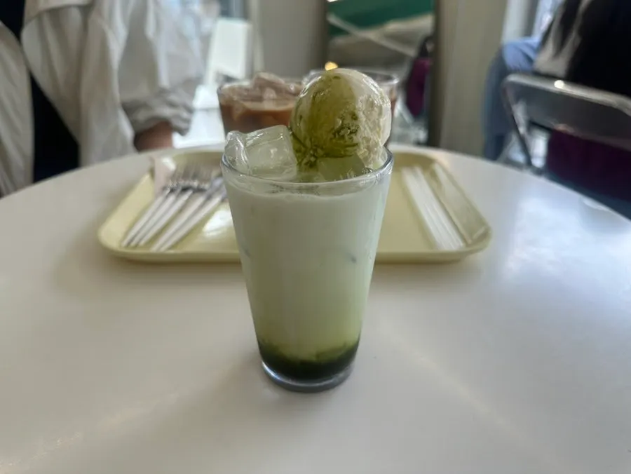 Matcha latte topped with ice cream