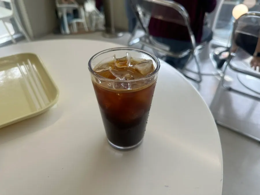 Iced Americano served with fig soufflé