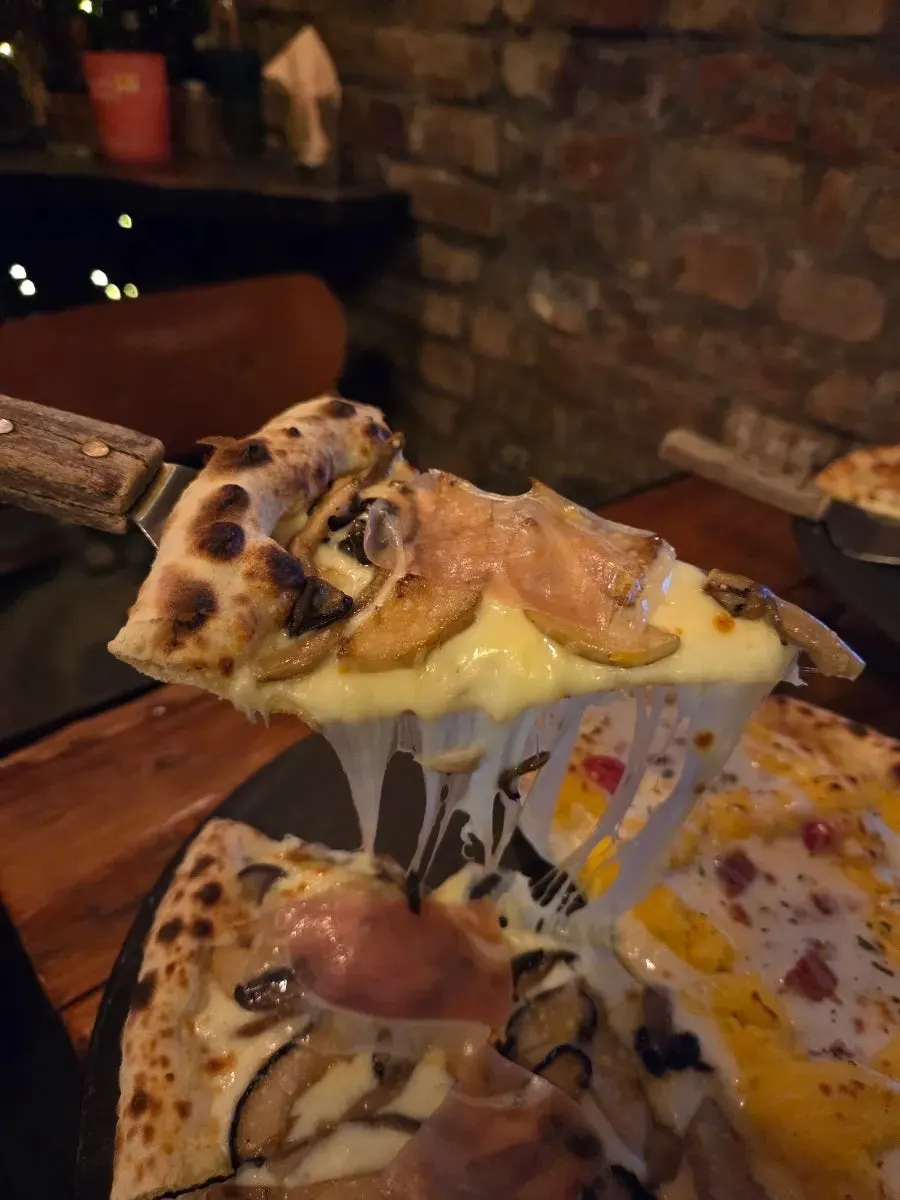 Close-up of a sliced wood-fired pizza