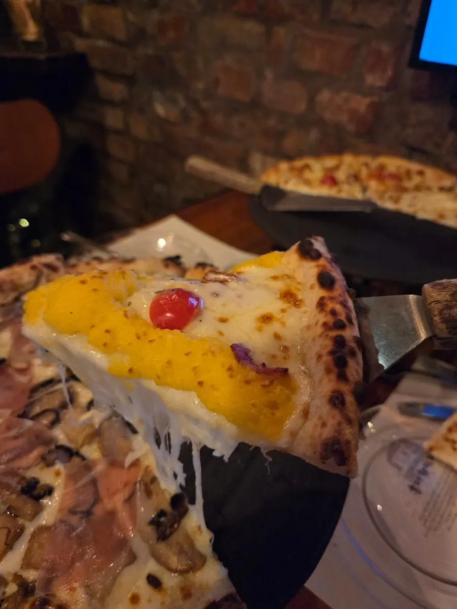 Cross-section of pizza showing the chewy dough