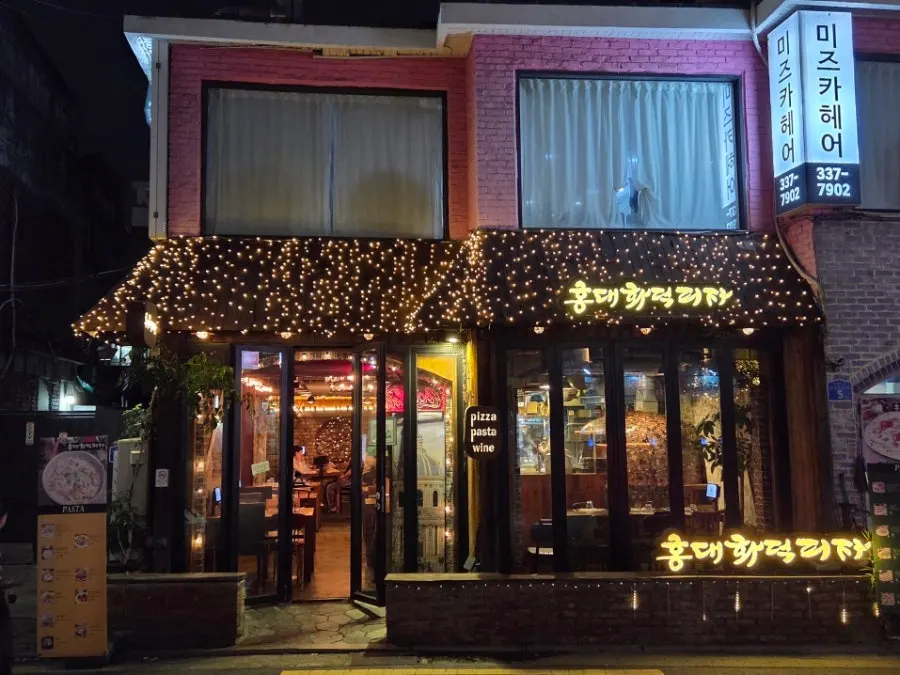 Exterior of the Hongdae Hwadeok Pizza storefront near Hapjeong Station