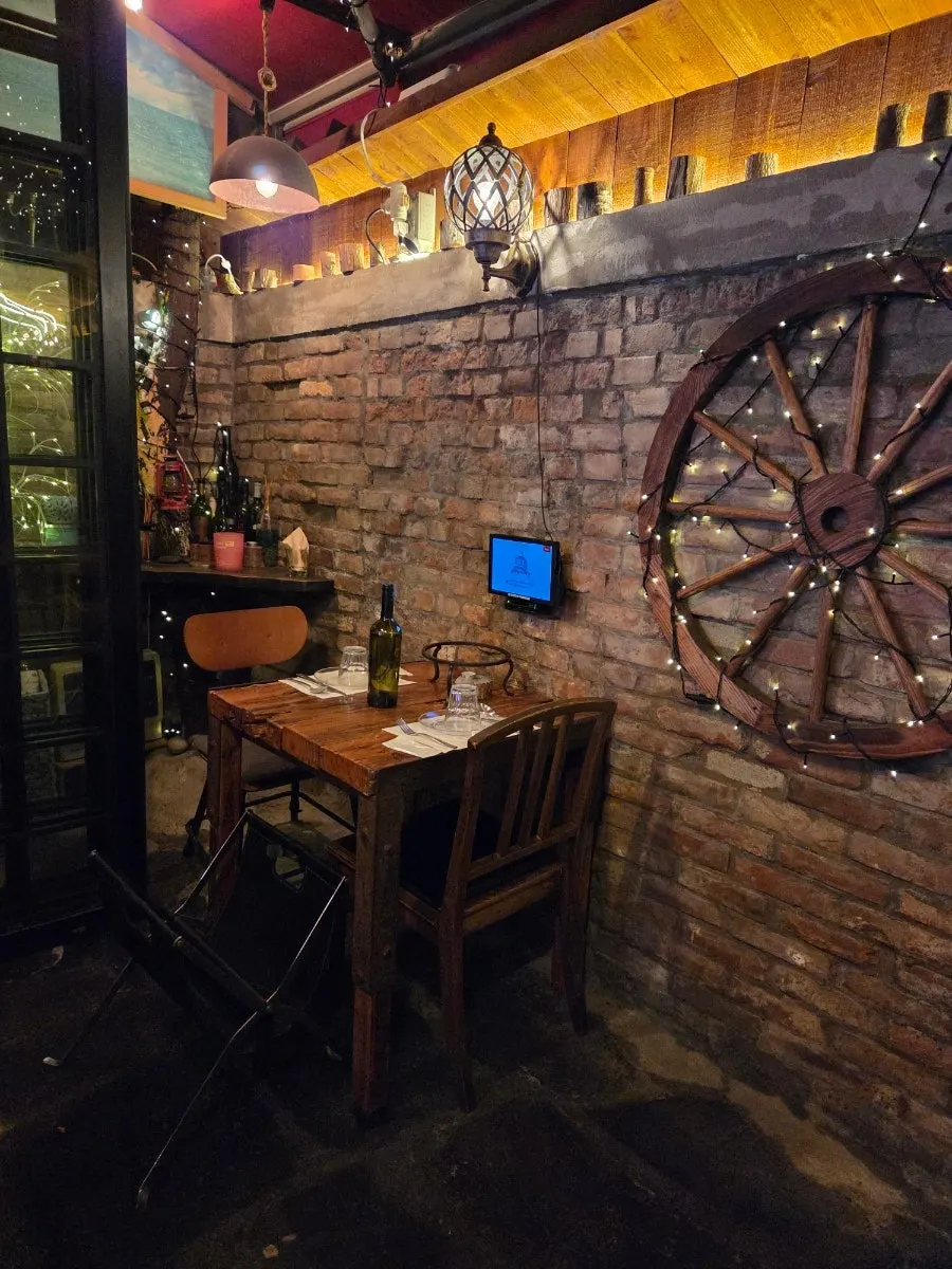 Interior of the restaurant with the wood-fired oven visible