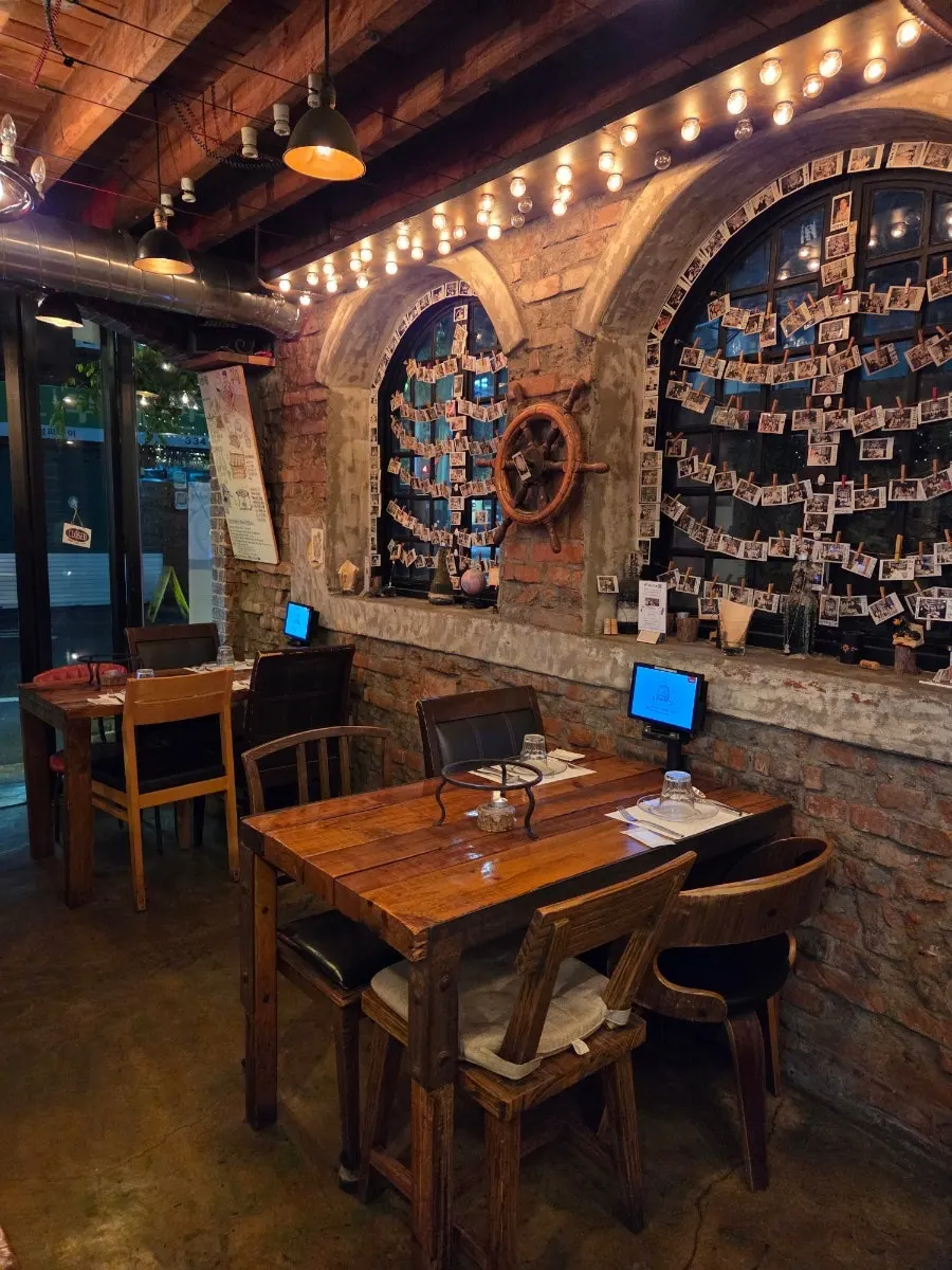 Seating area with tables for two and four